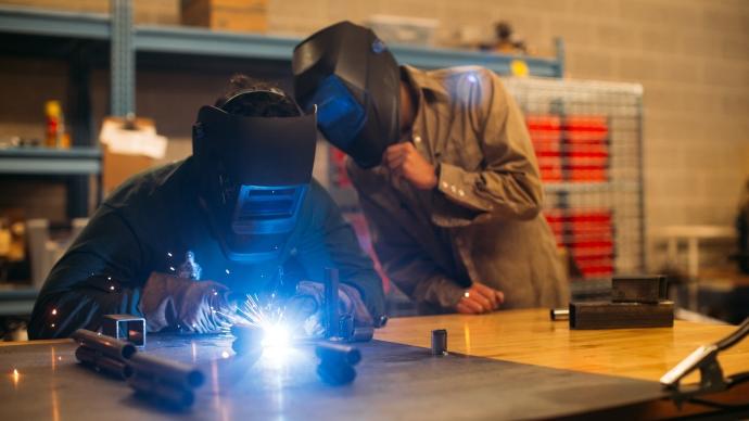 two students welding