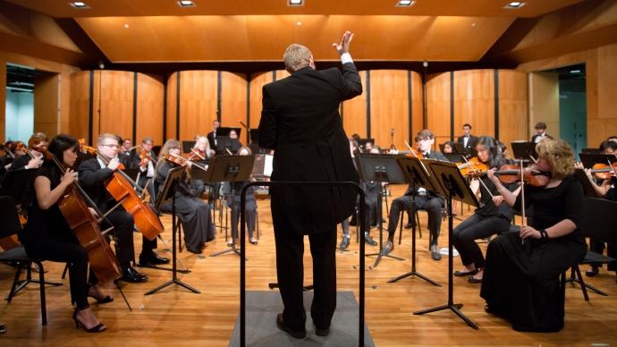 joseph kneer conducting an orchestra