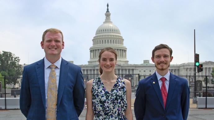 Three 澳门金沙线上赌博官网 Tigers and Capitol Hill staffers pose in front of the Capitol building