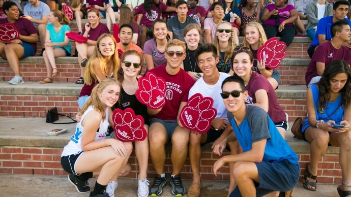 students gather together with spirit gear on the steps of the intramural field at trinity university