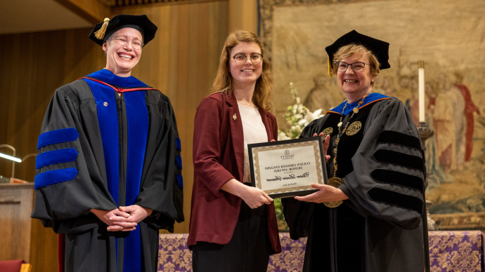 Claire Siewert receives their award from President Beasley and Provost Mustain.