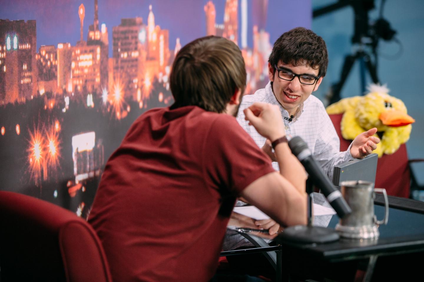 Two students sitting on stage for the Not So Late Show 