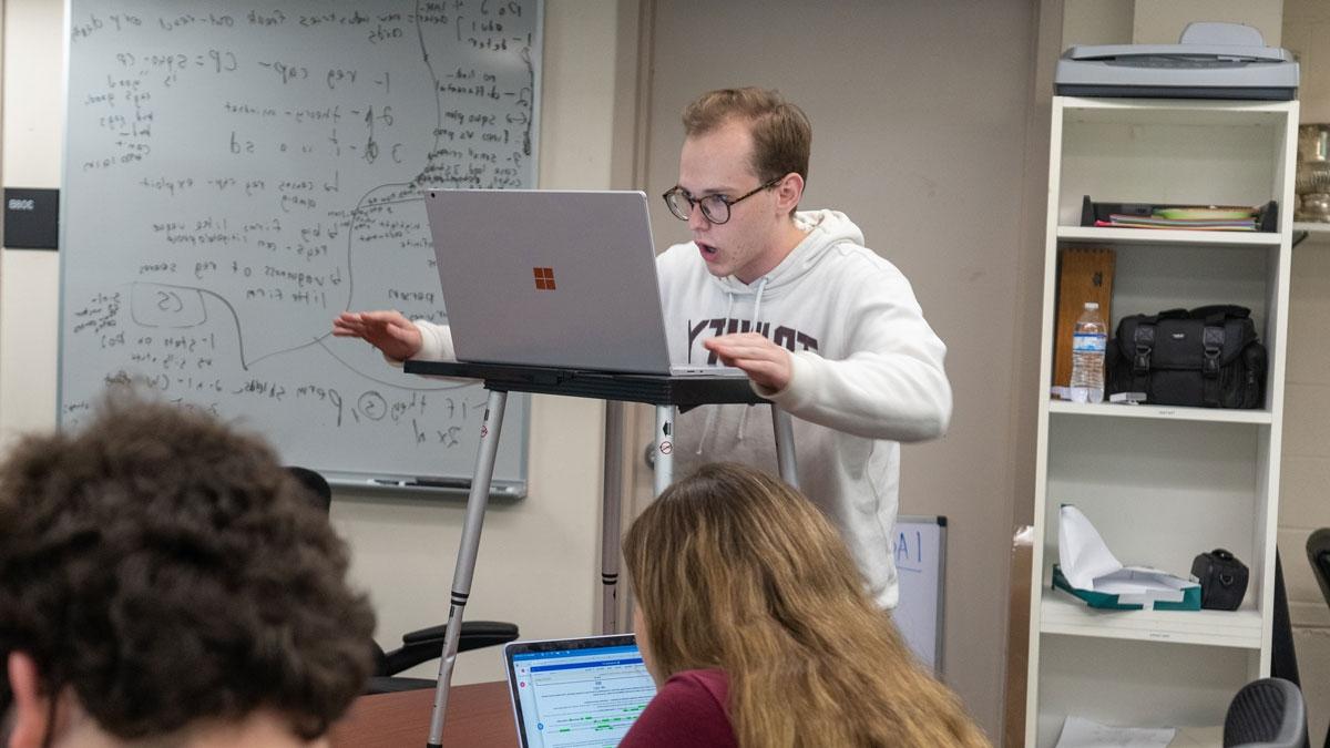 Kenneth Nelson '23 debates on laptop screen